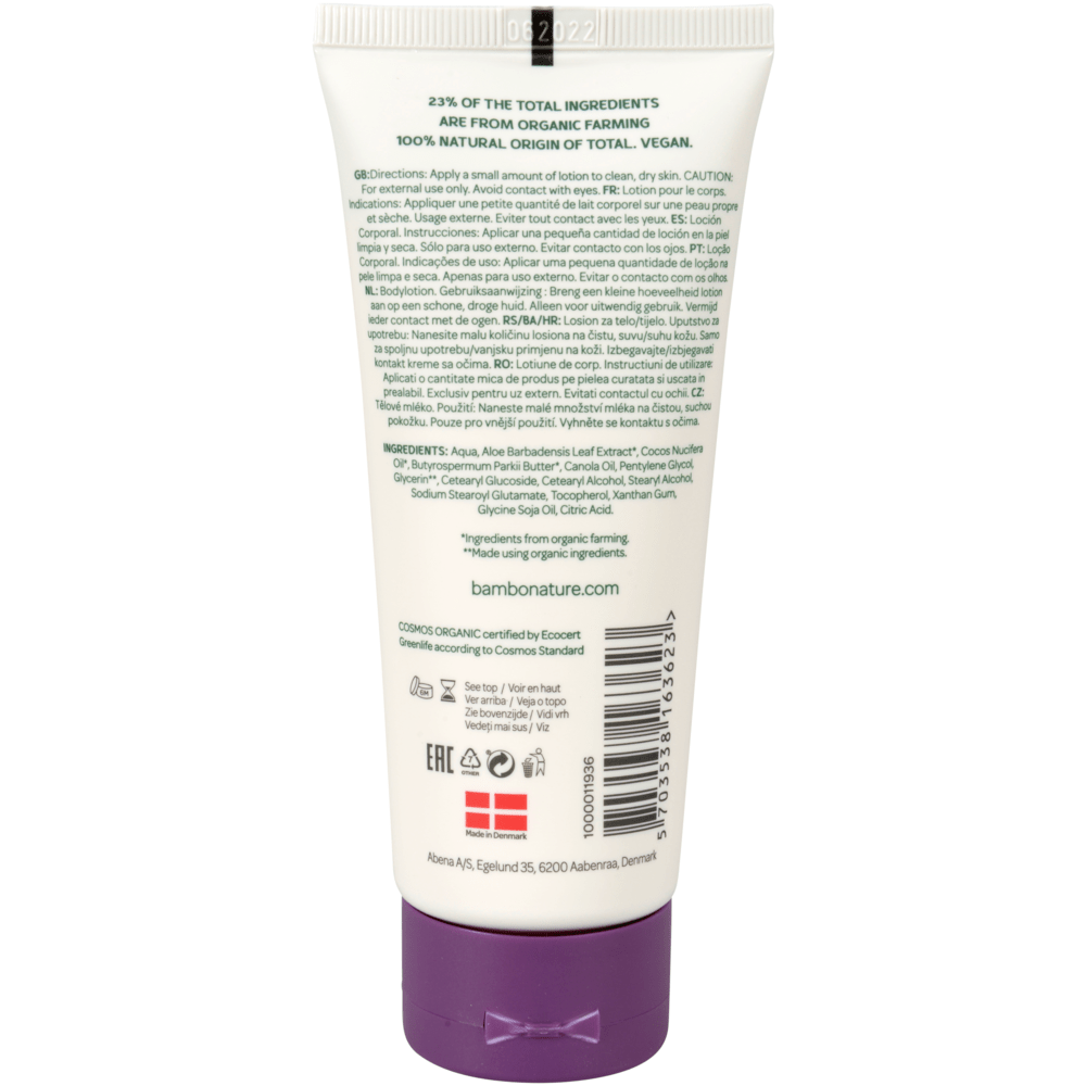 A white tube of Bambo Nature body lotion (100 ml, color and fragrance-free) from Abena Re-Seller GmbH with information on sensitive skin, hypoallergenic details, usage instructions, ingredients, certifications, barcode, and website on the back label. Package: 6 pieces.
