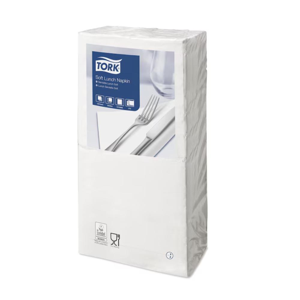 A pack of Tork 477414 Soft Lunch Napkins White Advanced 3-ply is wrapped in transparent plastic. The front label shows an image of white napkins with a fork and knife. The packaging includes recycling and food safety symbols, indicating that these napkins are industrially compostable. Brand: TORK - Essity Professional Hygiene Germany GmbH.