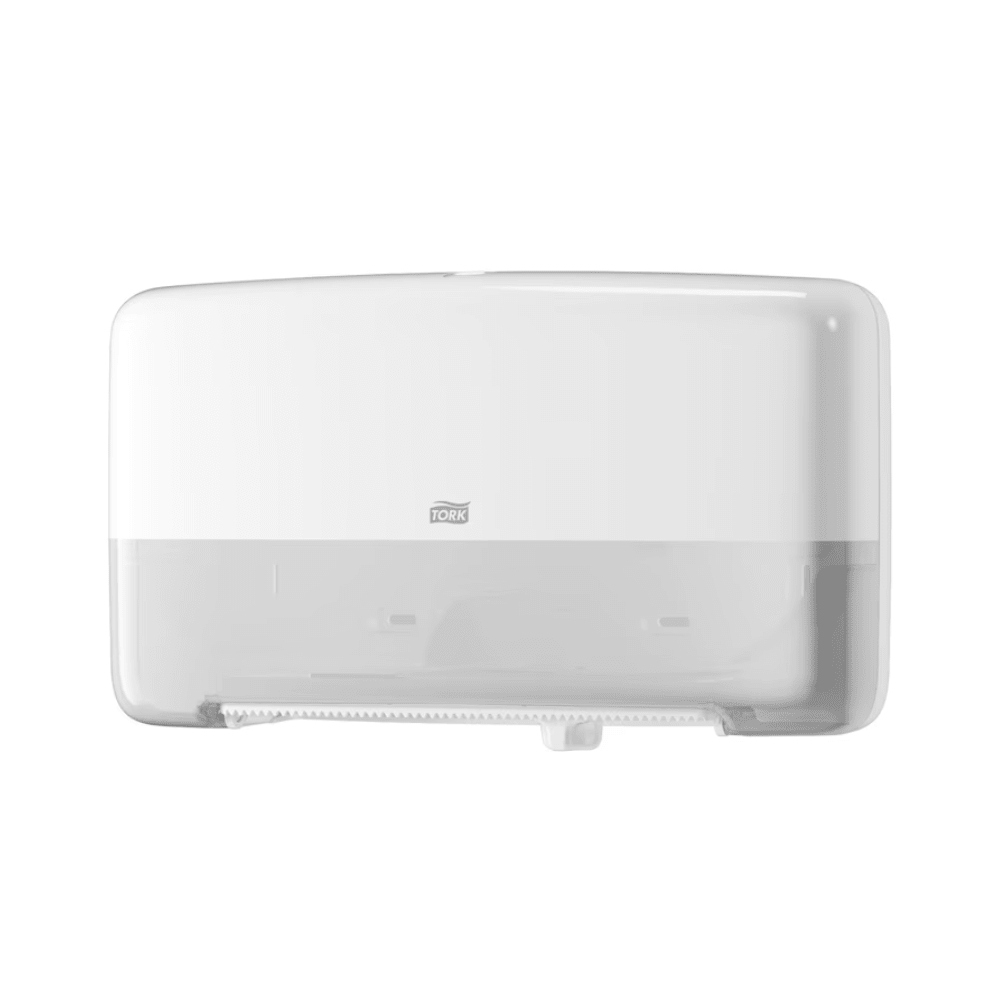 The Tork 555500 Twin Roll Dispenser for Mini Jumbo Toilet Paper T2 from TORK – Essity Professional Hygiene Germany GmbH features a transparent lower section that allows easy monitoring of the roll inside. Its sleek design includes a small logo on the front and a serrated edge for convenient tearing of paper towels.