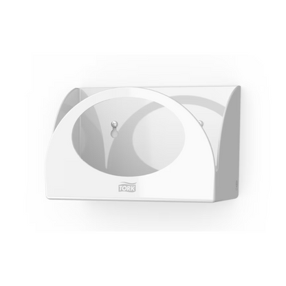 The Tork 655100 Small Pack Paper Dispenser Performance W8, manufactured by TORK – Essity Professional Hygiene Germany GmbH, is a white, wall-mounted tissue box holder that allows for space-saving wall installation. It has an open front design with two visible screws inside and is marked with 'Tork' to ensure hygienic protection.