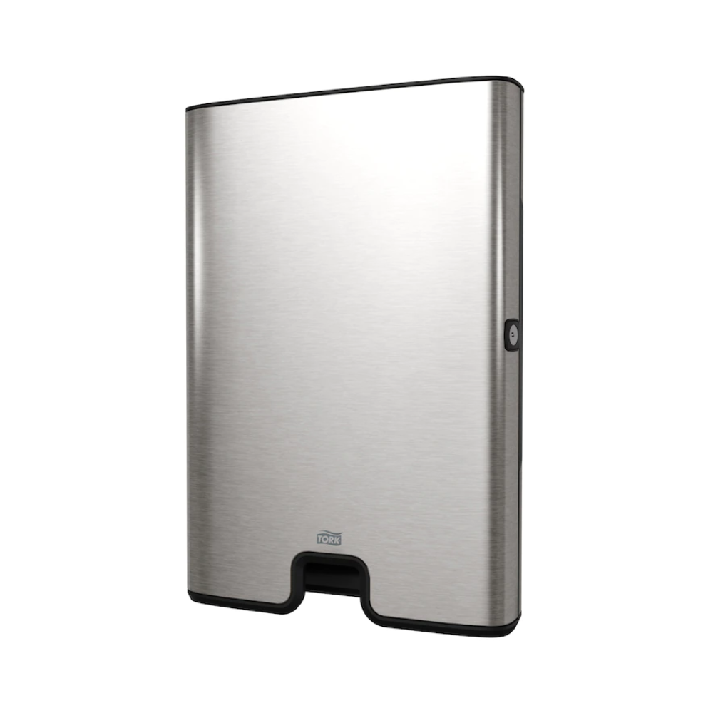 The CO2-neutral stainless steel hand dryer is elegantly mounted against a white background and features a sleek, rectangular shape with rounded edges and a visible sensor on the side. It seamlessly complements your Tork Xpress® 460004 dispenser for Multifold Hand Towels Image Line H2 by TORK – Essity Professional Hygiene Germany GmbH.