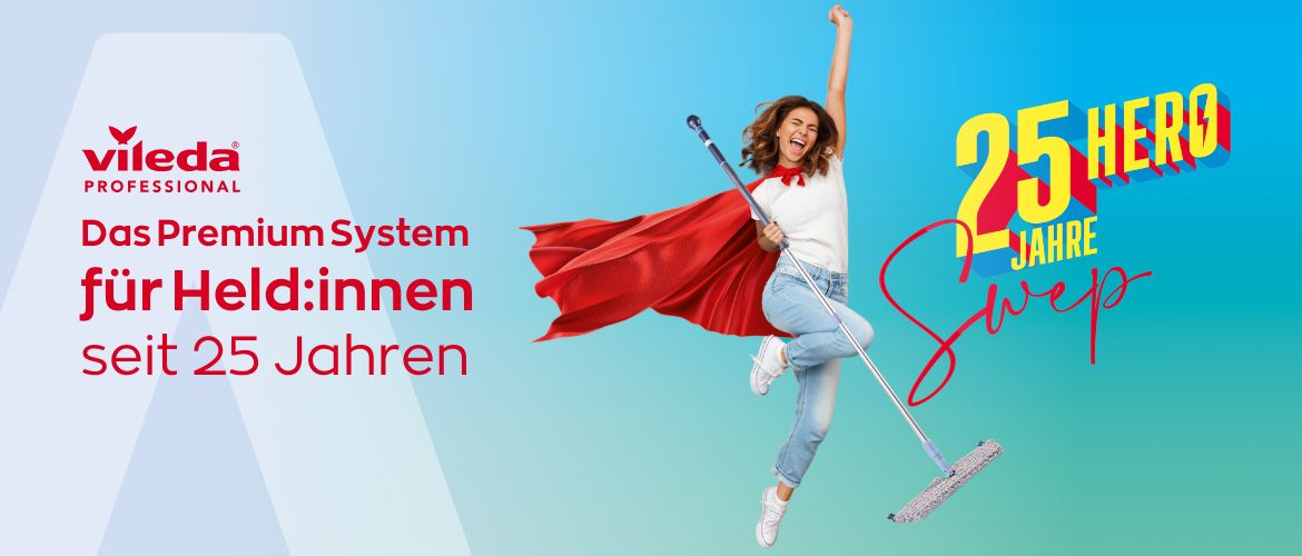 Eine Frau mit einem roten Umhang und einem Wischmopp in der Hand springt in der Nähe der fettgedruckten Aufschrift "25 HERO JAHRE" in die Luft. Der Text auf der linken Seite lautet: "Das Premium System für Held:innen seit 25 Jahren". Das Logo von Vileda Professional befindet sich oben links.