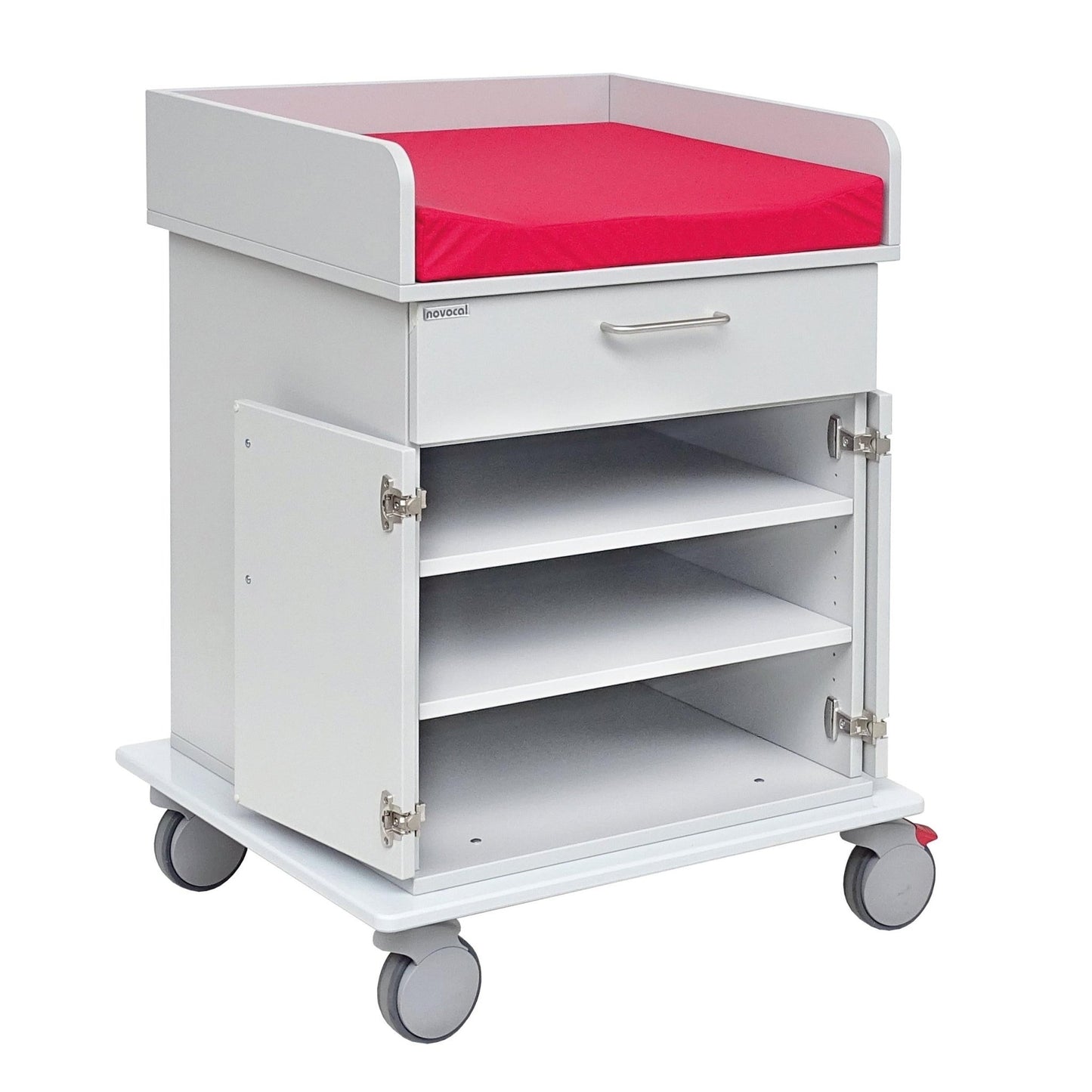 A white Novocal changing cart chassis cabinet with a durable full plastic top, red padded worktop, pull-out drawer, two open doors, and three shelves for storage and mobility.