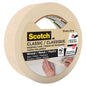 A hand holds a roll of 3M Scotch® Classic Masking Tape (36 mm x 50 m, 1 roll, 70% PEFC, SGSCH-PEFC-COC-110078) from 3M Deutschland GmbH. The label indicates that it is suitable for wood, metal, and plastic surfaces.