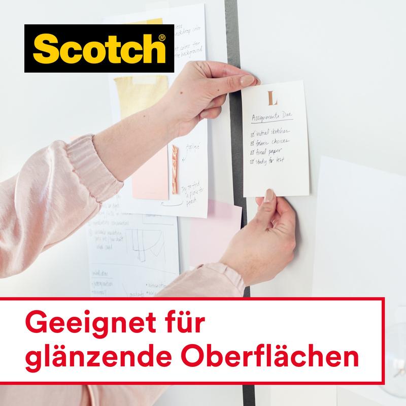 A person attaches a note to a wall with Scotch® Crystal Tape 6-1925D from 3M Deutschland GmbH (19 mm x 25 m, on hand dispenser). Various notes are hanging on the wall. Text: "Suitable for glossy surfaces".