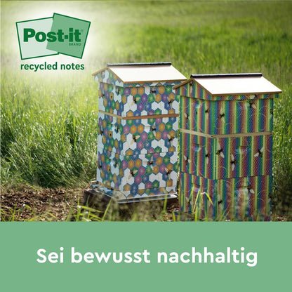 Two decorated beehives stand on a meadow, the logo of Post-it® Super Sticky 100% Recycled Notes (47.6 x 47.6 mm, 70 sheets/block, 100% PEFC) from 3M Deutschland GmbH is visible in the top left. The German text reads: "Be consciously sustainable.