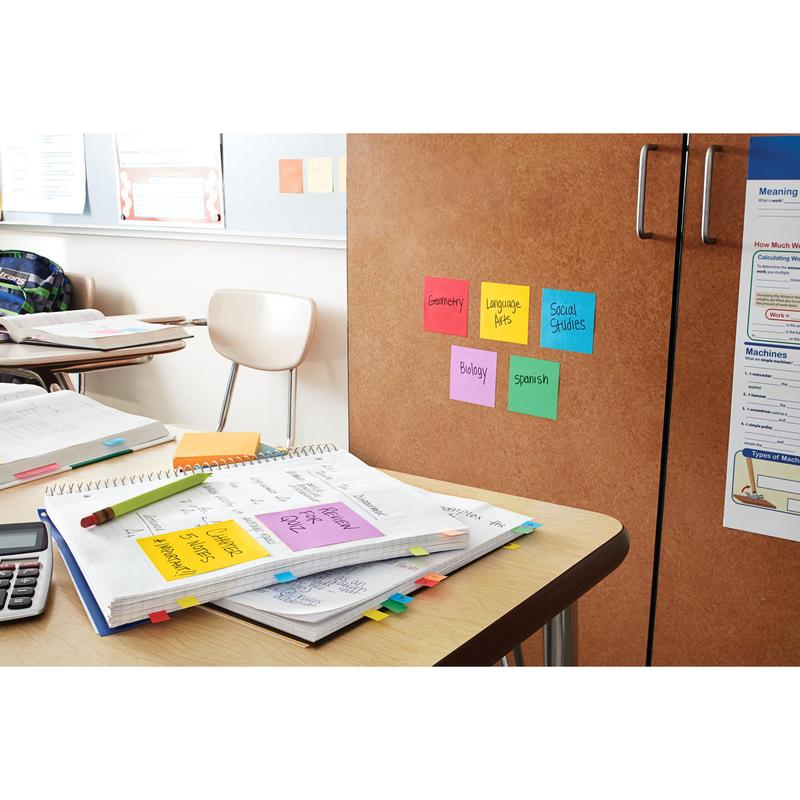 On a classroom desk lie open notebooks, papers, and a calculator. On a cabinet, there are 3M Post-it® Super Sticky Notes (47.6x47.6 mm, 90 sheets/block), labeled with subjects like Geometry and Biology. Empty chairs and a backpack complete the scene.